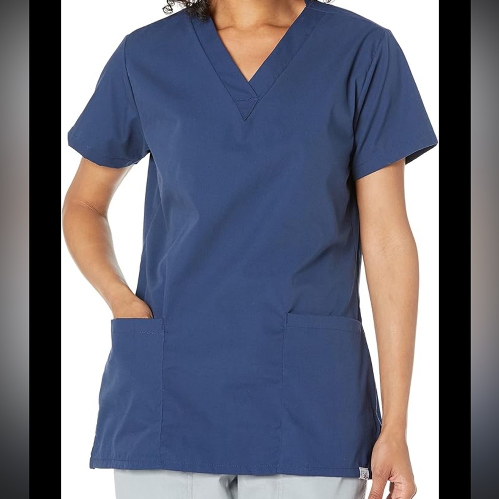 Navy blue V-neck medical scrub top with front pockets, from the Workwear Profess